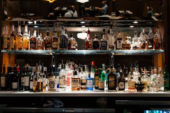 displayed liquor bottles on shelves